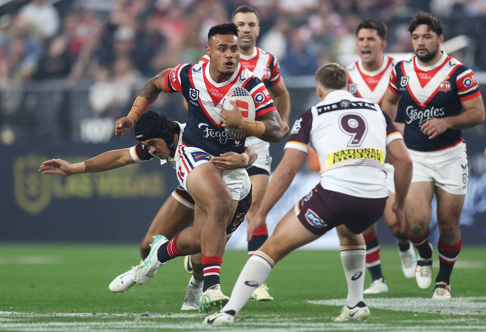 LAS VEGAS, NEVADA - MARCH 02: Spencer Leniu of the Roosters rusn the ball during the round one NRL match between Sydney Roosters and Brisbane Broncos at Allegiant Stadium, on March 02, 2024, in Las Vegas, Nevada. (Photo by Ezra Shaw/Getty Images)