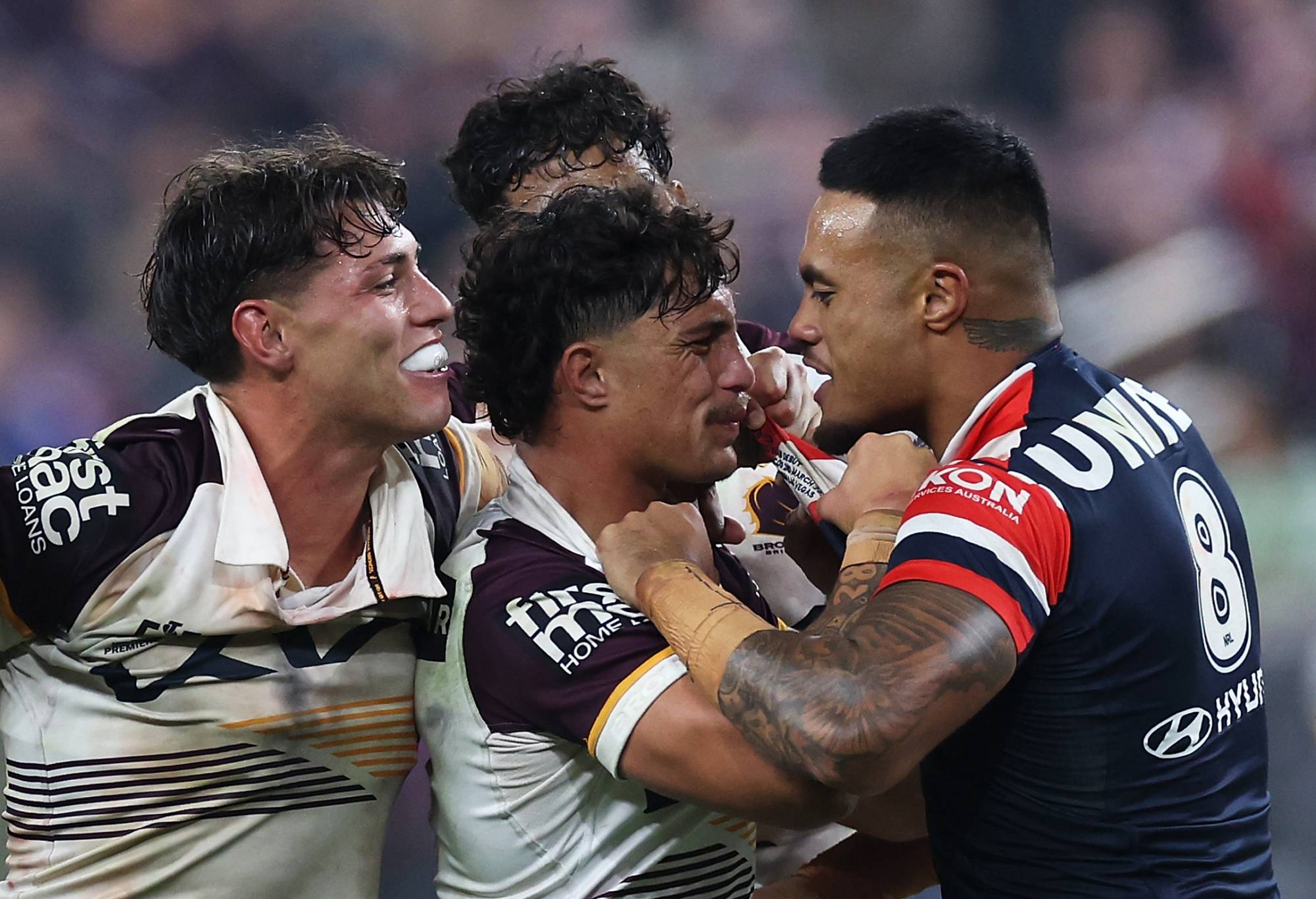 LAS VEGAS, NEVADA - MARCH 02: Spencer Leniu (r) of the Roosters exchanges heated words with Kotoni Staggs of the Broncos during the round one NRL match between Sydney Roosters and Brisbane Broncos at Allegiant Stadium, on March 02, 2024, in Las Vegas, Nevada. (Photo by Ezra Shaw/Getty Images)
