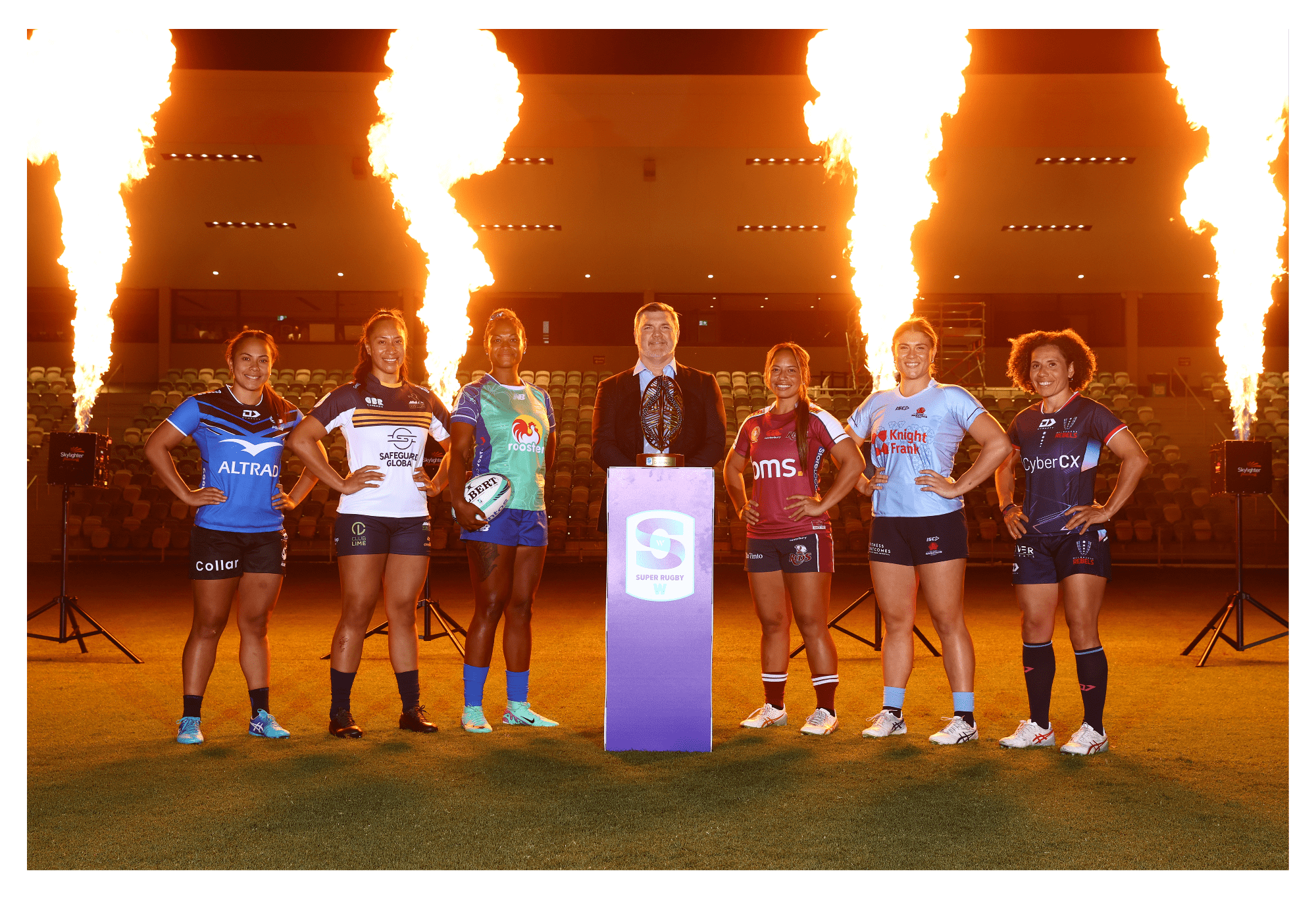 RA Chair Dan Herbert poses with players Melanie Kawa of the Rebels, Piper Duck of the Waratahs, Asinate Serevi of Fiji Drua, Cecilia Smith of the Reds, Siokapesi Palu of the Brumbies and Trilleen Pomary of the Force during the 2024 Super Rugby Women's Season Launch at Ballymore Stadium on March 06, 2024 in Brisbane, Australia. (Photo by Chris Hyde/Getty Images for Rugby Australia)