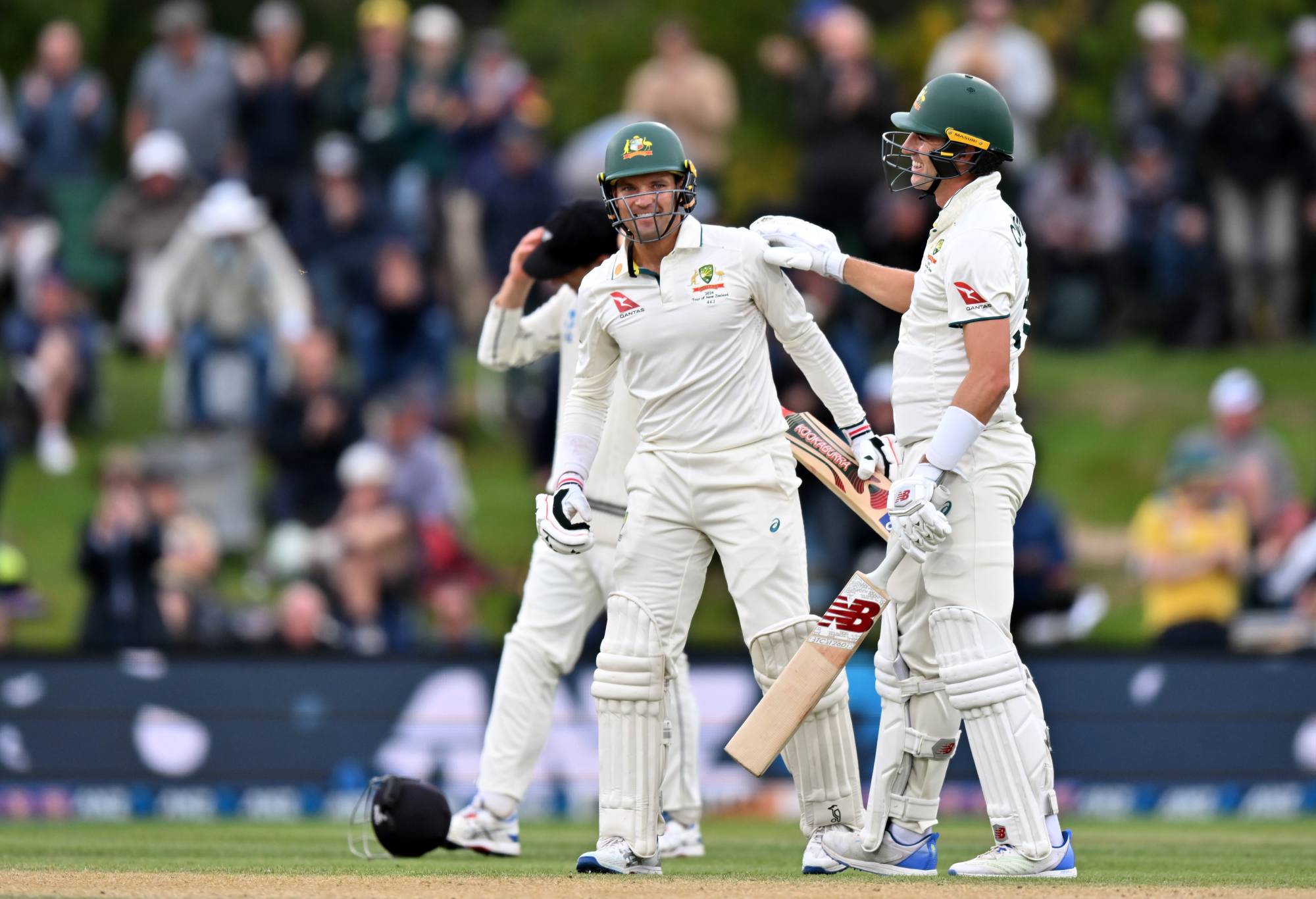 Alex Carey and Pat Cummins of Australia (L-R) celebrate their win during day four of the Second Test in the series between New Zealand and Australia at Hagley Oval on March 11, 2024 in Christchurch, New Zealand. (Photo by Kai Schwoerer/Getty Images)