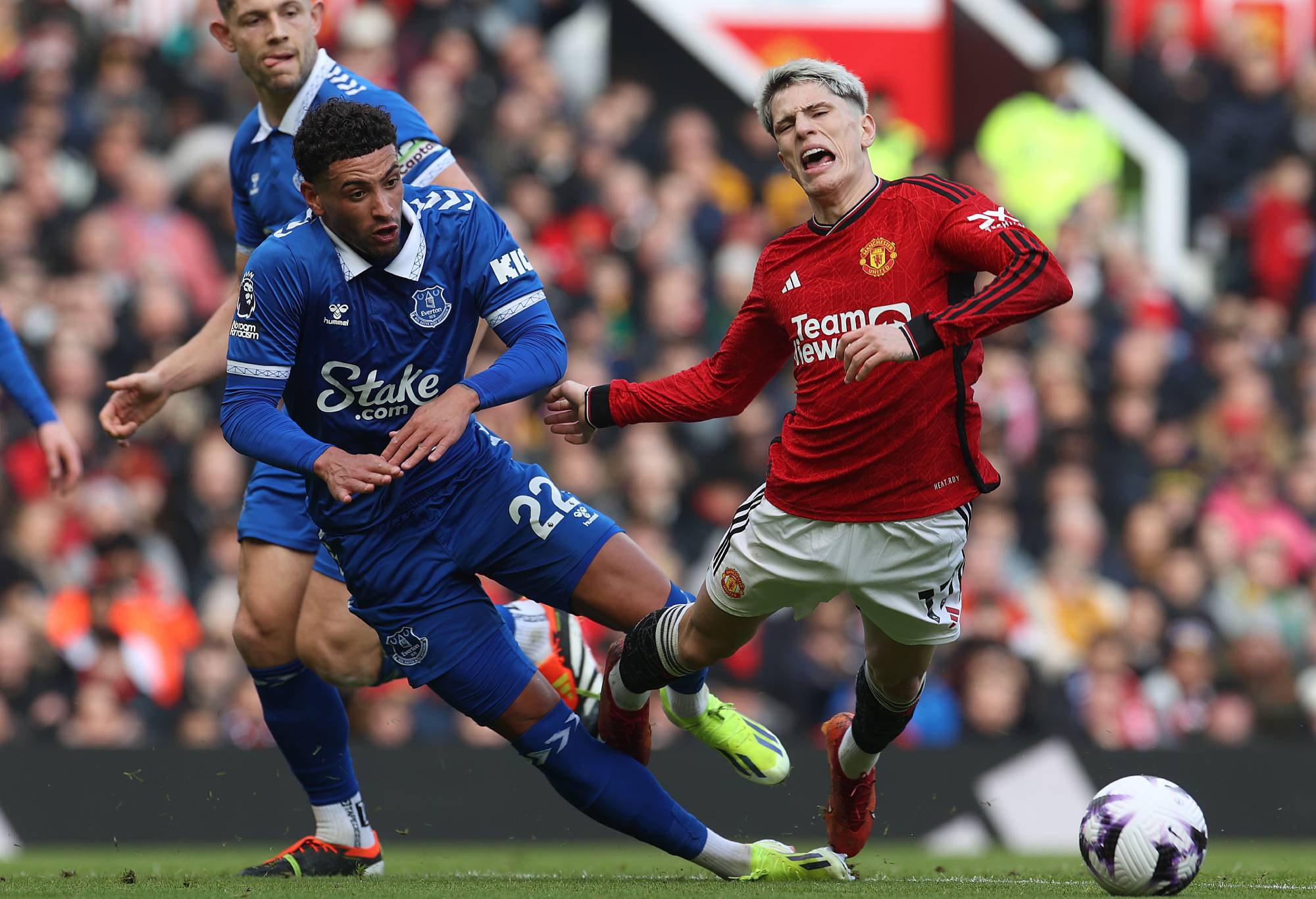 MANCHESTER, ENGLAND - MARCH 09: Alejandro Garnacho of Manchester United is fouled by Ben Godfrey of Everton during the Premier League match between Manchester United and Everton FC at Old Trafford on March 09, 2024 in Manchester, England. (Photo by Matthew Peters/Manchester United via Getty Images)