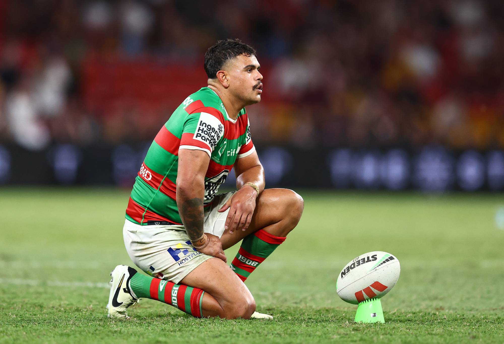 BRISBANE, AUSTRALIA - MARCH 14: Latrell Mitchell of the Rabbitohs prepares to kick during the round two NRL match between Brisbane Broncos and South Sydney Rabbitohs at Suncorp Stadium, on March 14, 2024, in Brisbane, Australia. (Photo by Chris Hyde/Getty Images)