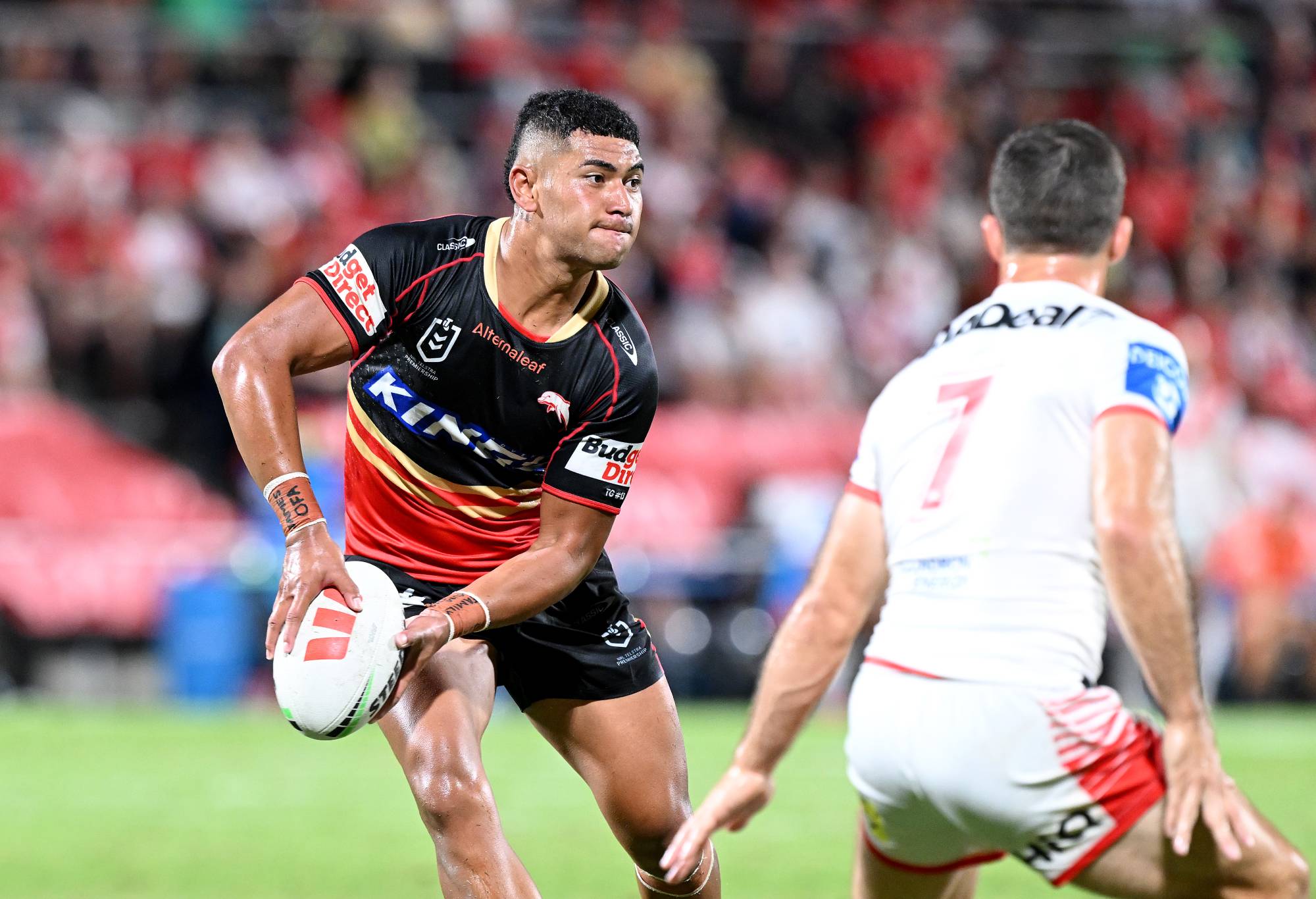 BRISBANE, AUSTRALIA - MARCH 17: Isaiya Katoa of the Dolphins passes the ball during the round two NRL match between the Dolphins and St George Illawarra Dragons at Kayo Stadium, on March 17, 2024, in Brisbane, Australia. (Photo by Bradley Kanaris/Getty Images)