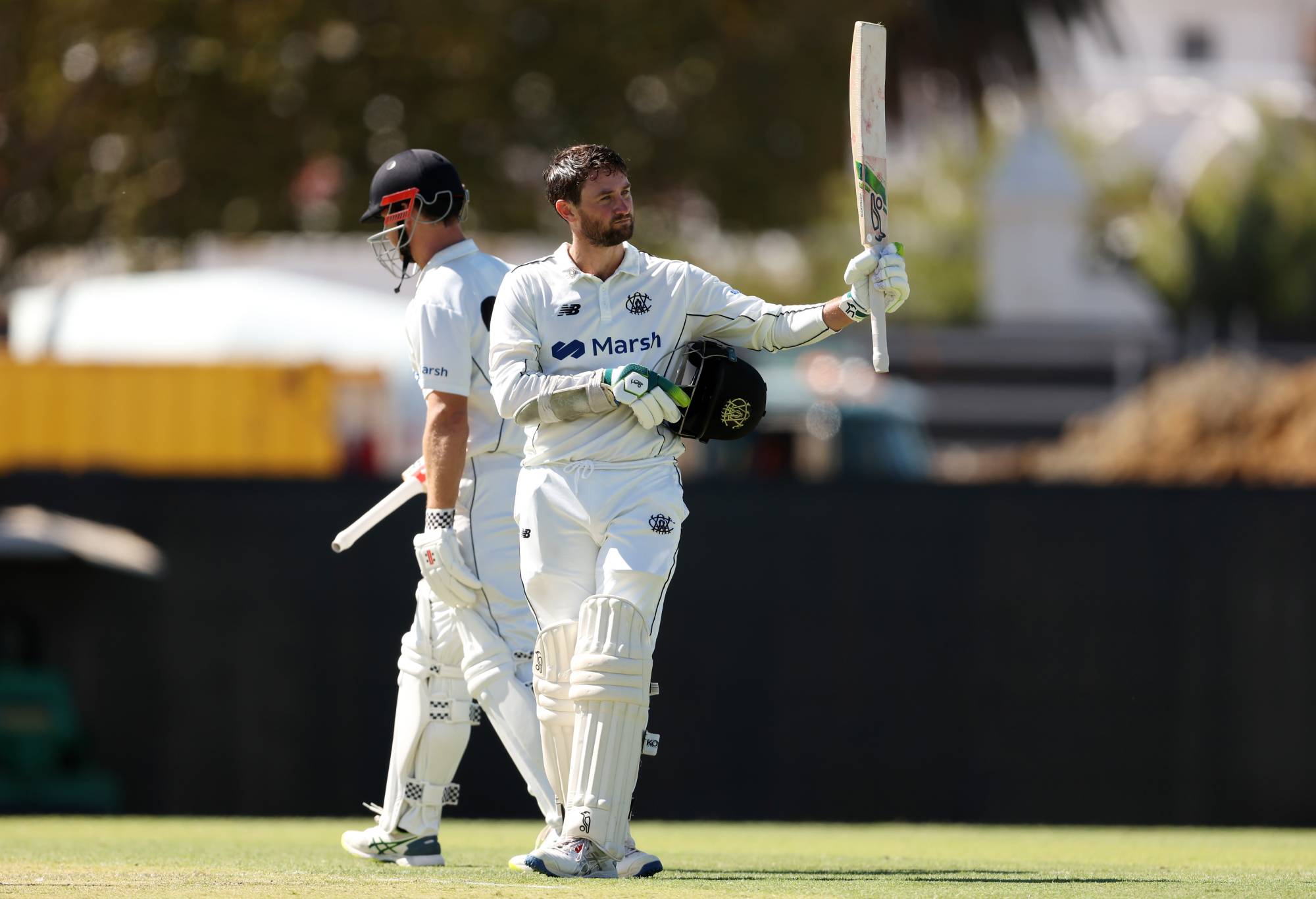 PERTH, AUSTRALIA - MARCH 21: Sam Whiteman of Western Australia raises his bat after scoring 100 runs during day one of the Sheffield Shield Final match between Western Australia and Tasmania at WACA, on March 21, 2024, in Perth, Australia. (Photo by Will Russell/Getty Images)