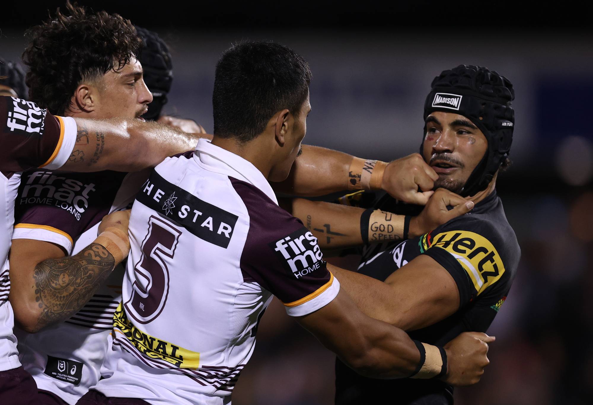 PENRITH, AUSTRALIA - MARCH 21: Taylan May of the Panthers scuffles with Deine Mariner of the Broncos during the round three NRL match between Penrith Panthers and Brisbane Broncos at BlueBet Stadium on March 21, 2024 in Penrith, Australia. (Photo by Jason McCawley/Getty Images)