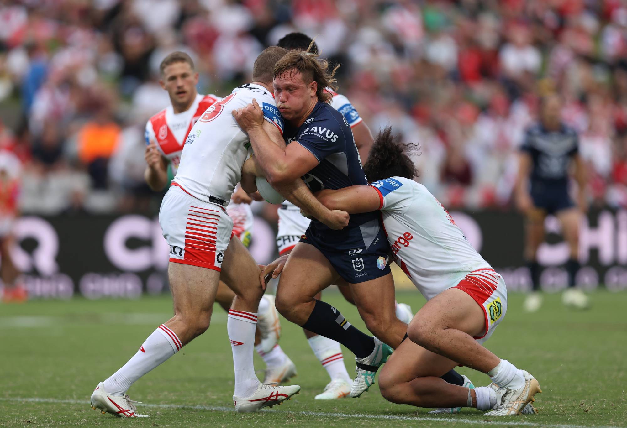 SYDNEY, AUSTRALIA - MARCH 23: Reuben Cotter of the Cowboys is tackled during the round three NRL match between St George Illawarra Dragons and North Queensland Cowboys at Netstrata Jubilee Stadium on March 23, 2024 in Sydney, Australia. (Photo by Jason McCawley/Getty Images)