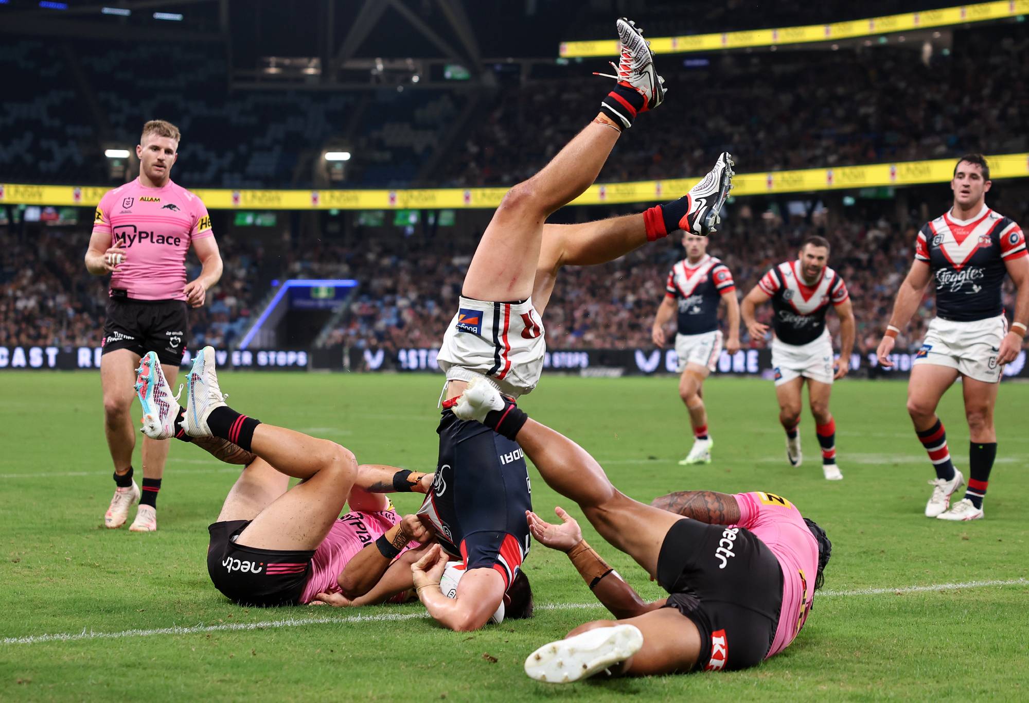 SYDNEY, AUSTRALIA - MARCH 28: Joseph Manu of the Roosters scores a try, which was then disallowed by the video bunker during the round four NRL match between Sydney Roosters and Penrith Panthers at Allianz Stadium on March 28, 2024, in Sydney, Australia. (Photo by Cameron Spencer/Getty Images)