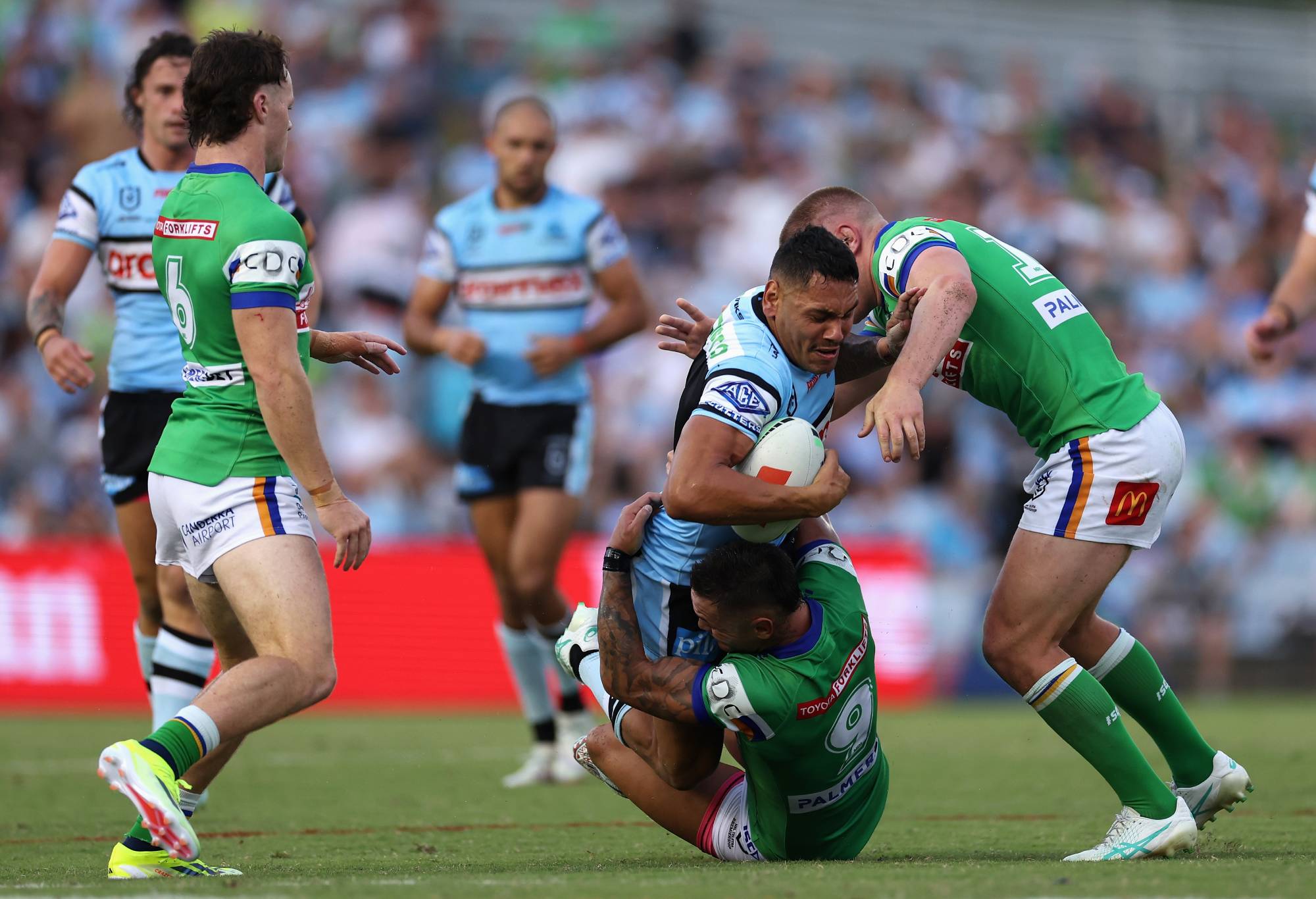 SYDNEY, AUSTRALIA - MARCH 31: Jesse Ramien of the Sharks is tackled during the round four NRL match between Cronulla Sharks and Canberra Raiders at PointsBet Stadium, on March 31, 2024, in Sydney, Australia. (Photo by Cameron Spencer/Getty Images)