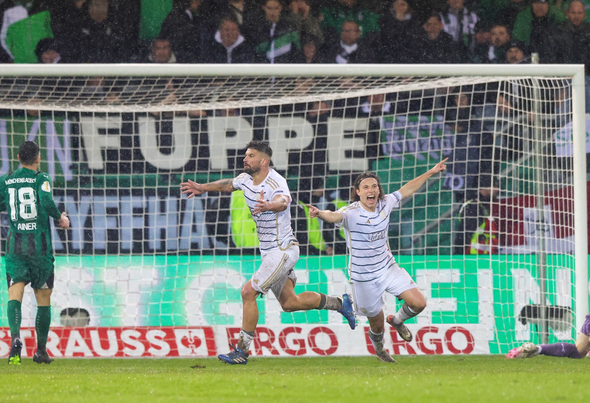 Kai Brünker of 1. FC Saarbrücken (C) celebrates after scoring his teams second goal during the DFB cup quarterfinal match between 1. FC Saarbrücken and Borussia Mönchengladbach at Ludwigsparkstadion on March 12, 2024 in Saarbruecken, Germany. (Photo by Ralf Ibing - firo sportphoto/Getty Images)