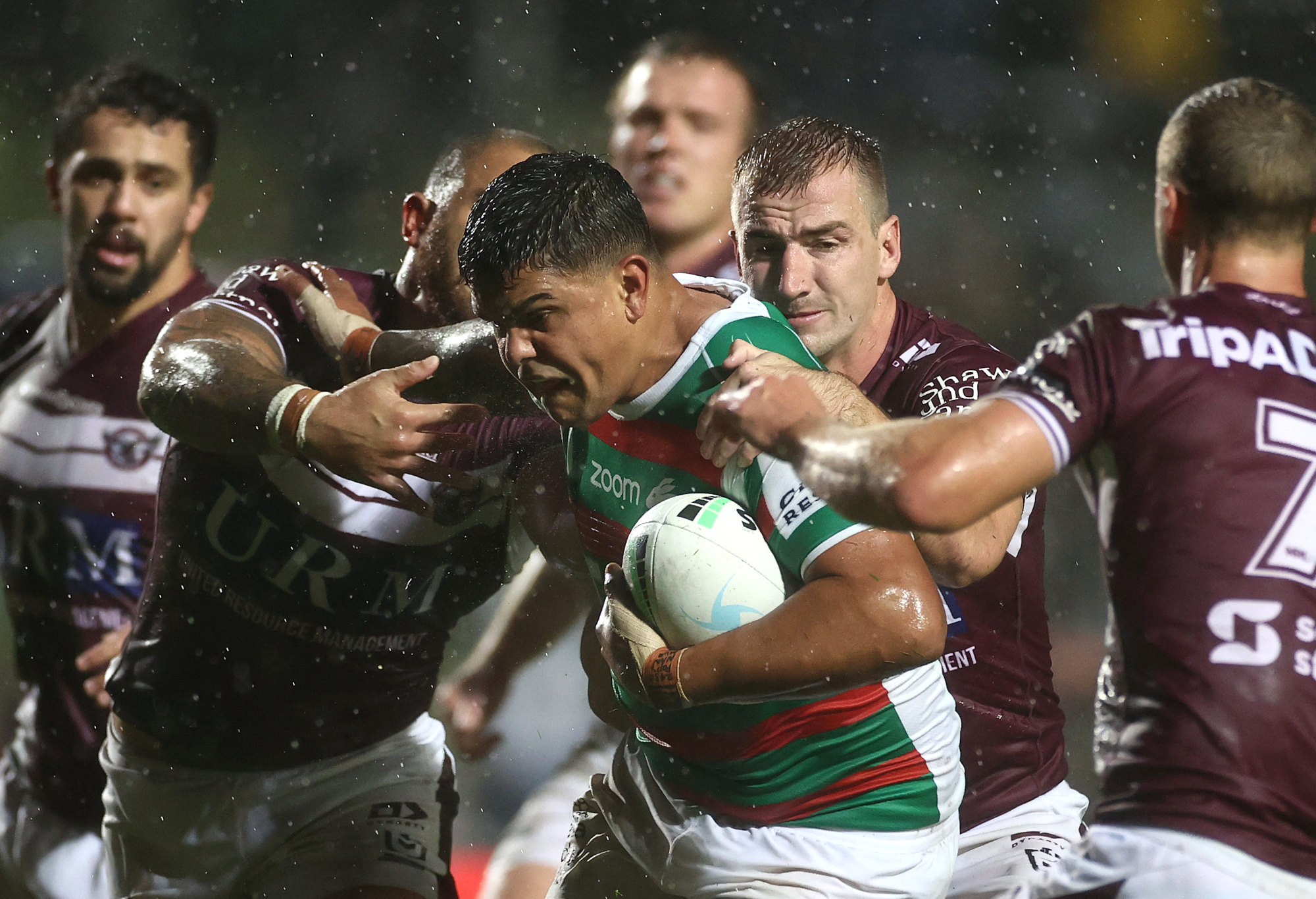 Latrell Mitchell of the South Sydney Rabbitohs is tackled