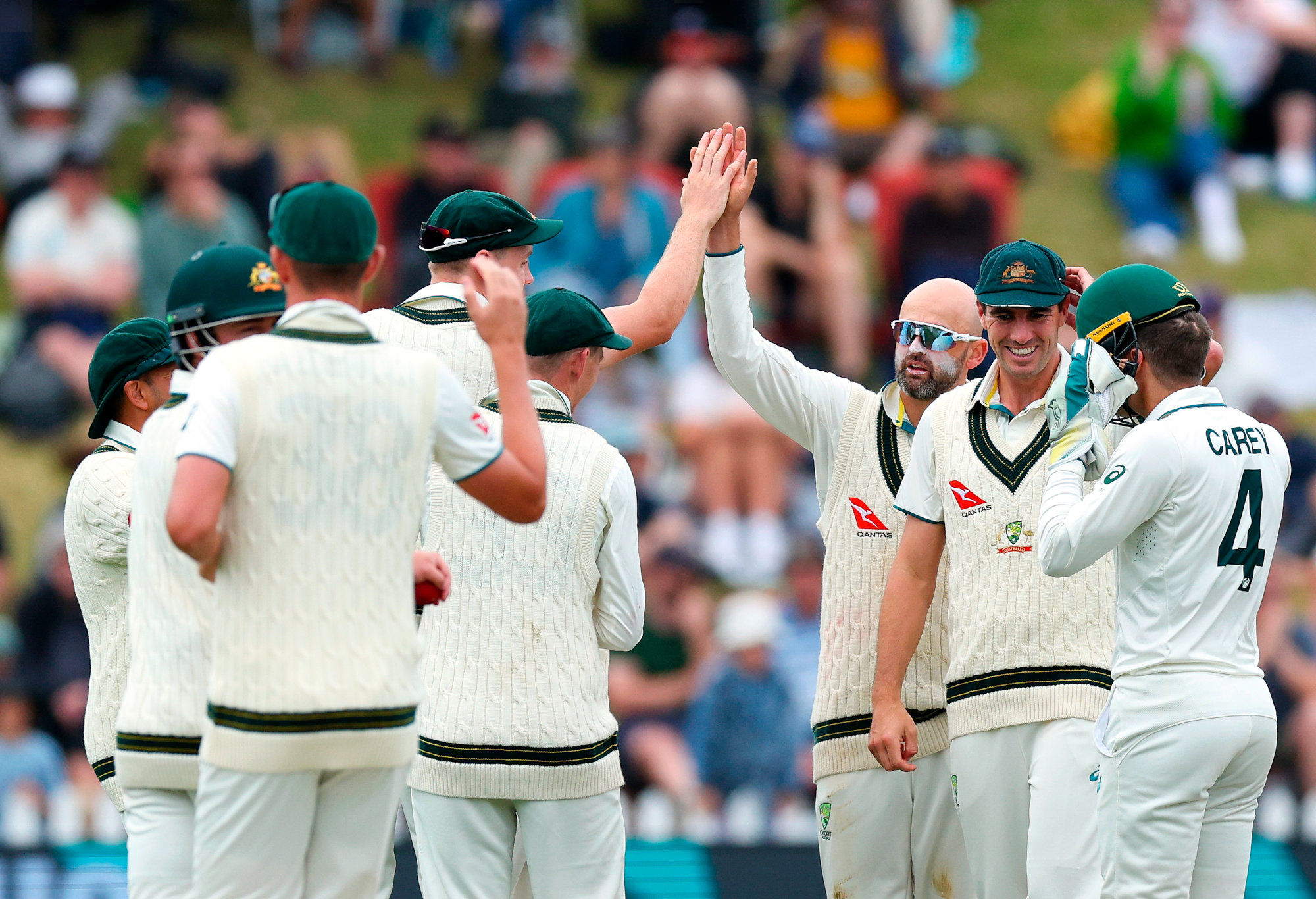 Nathan Lyon celebrates one of his six wickets.