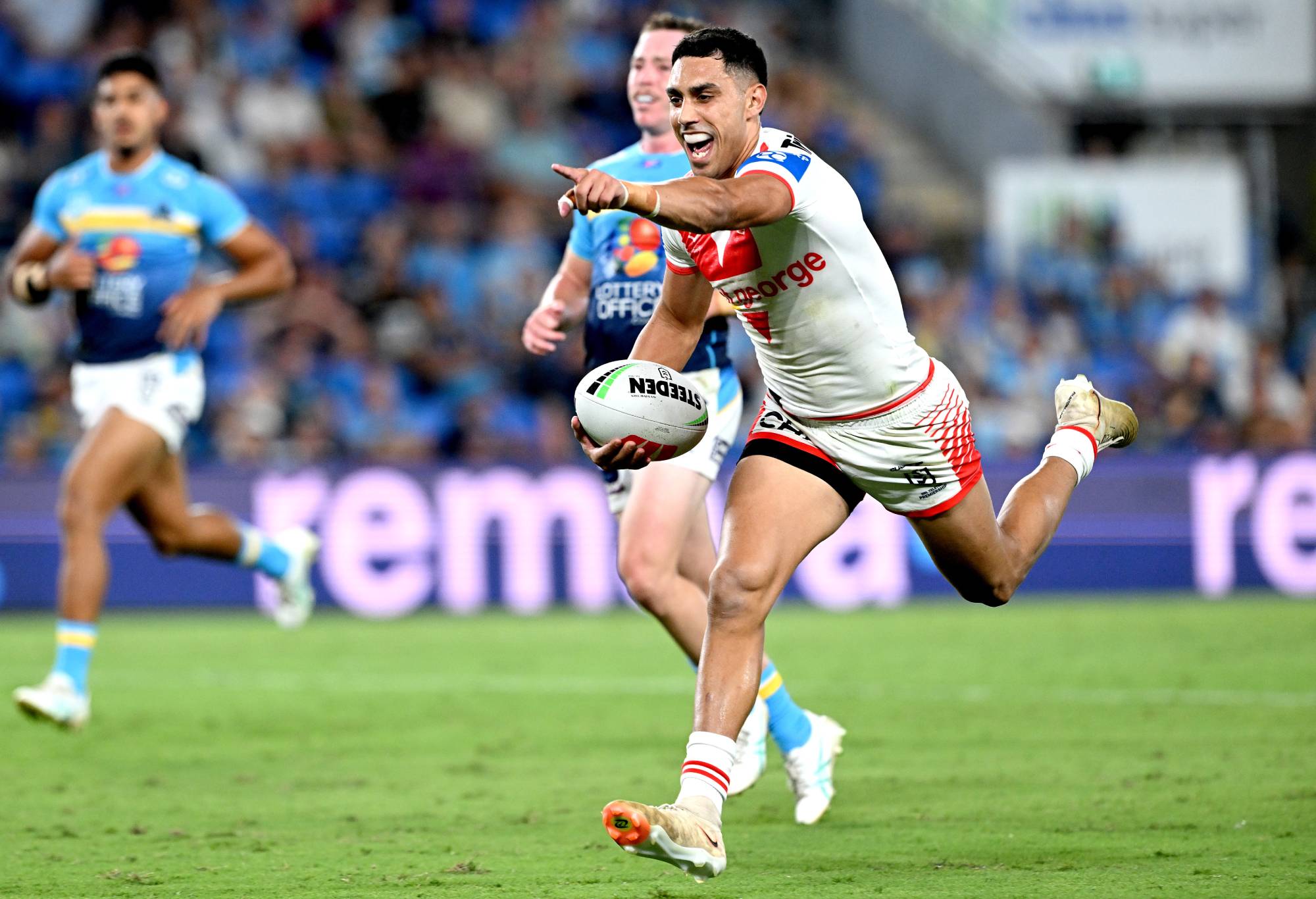 GOLD COAST, AUSTRALIA - MARCH 09: Tyrell Sloan of the Dragons celebrates after scoring a try during the round one NRL match between the Gold Coast Titans and St George Illawarra Dragons at Cbus Super Stadium, on March 09, 2024, in Gold Coast, Australia.