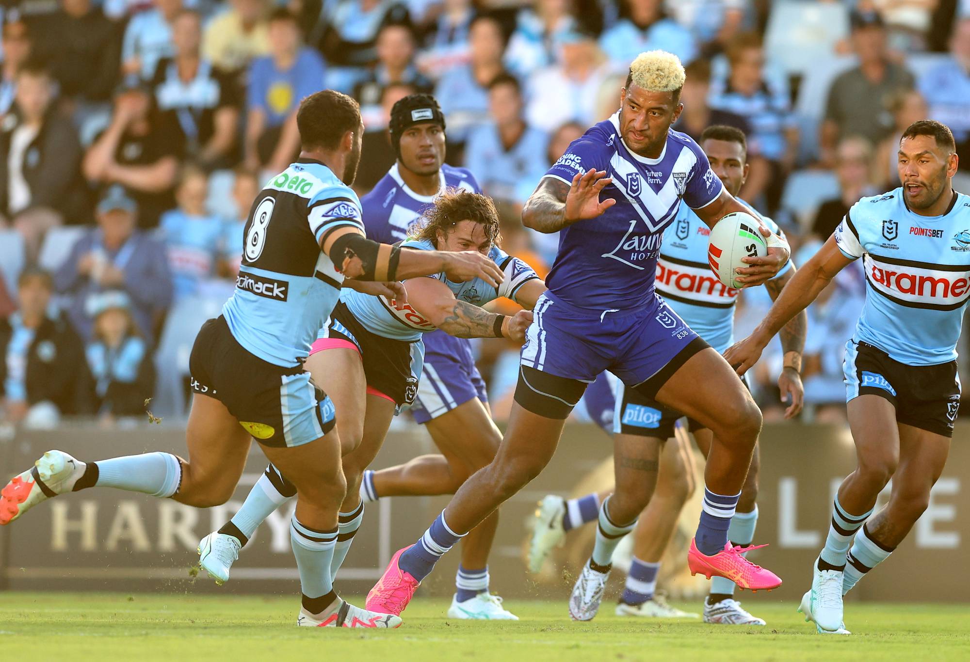 SYDNEY, AUSTRALIA - MARCH 15: Viliame Kikau of the Bulldogs is tackled during the round two NRL match between Cronulla Sharks and Canterbury Bulldogs at PointsBet Stadium on March 15, 2024, in Sydney, Australia.