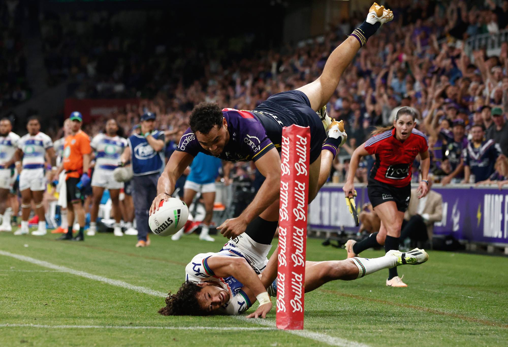 MELBOURNE, AUSTRALIA - MARCH 16: Xavier Coates of the Storm scores the match winning try during the round two NRL match between Melbourne Storm and New Zealand Warriors at AAMI Park, on March 16, 2024, in Melbourne, Australia.
