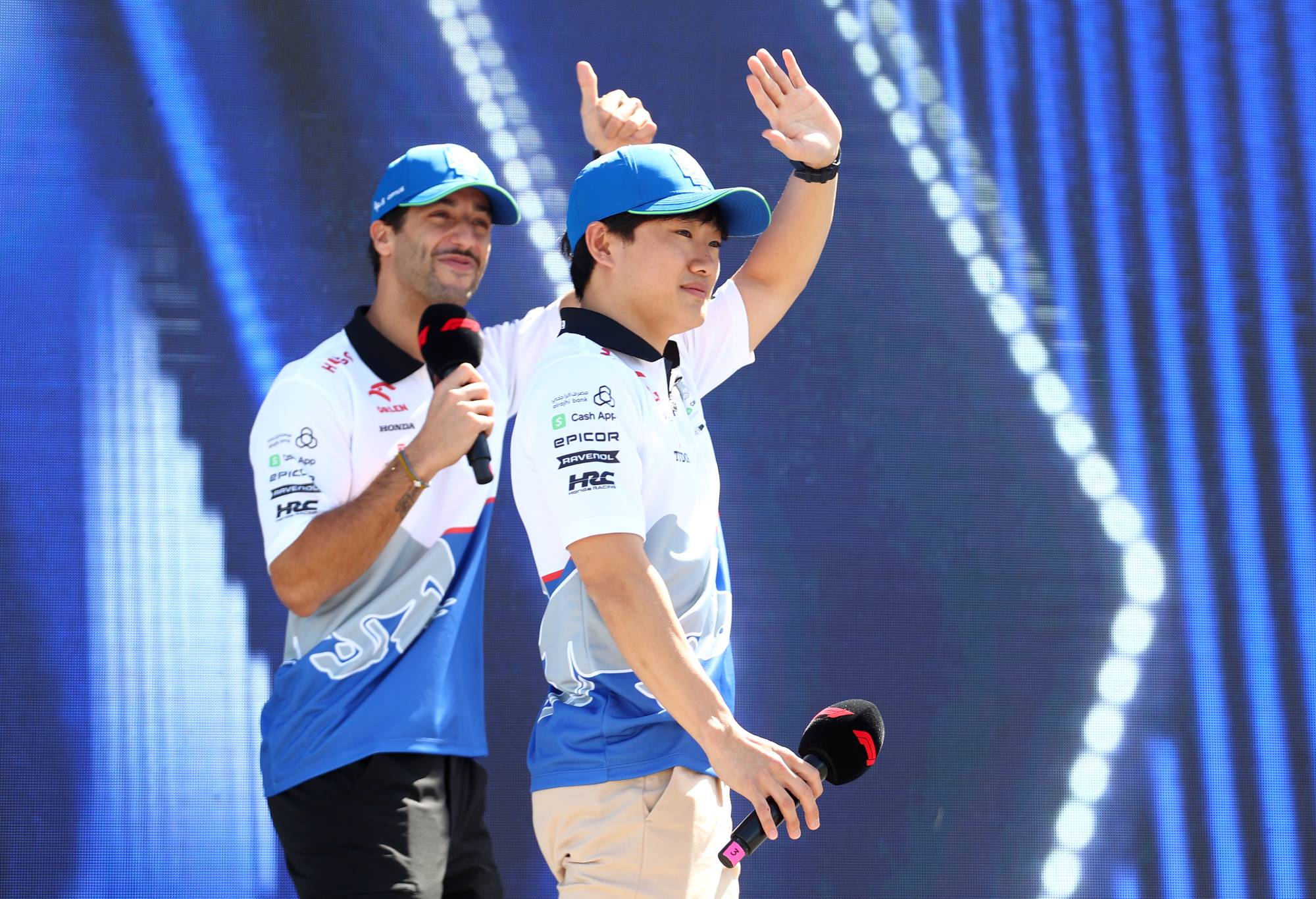 Daniel Ricciardo of Australia and Visa Cash App RB and Yuki Tsunoda of Japan and Visa Cash App RB talk to the crowd on the fan stage prior to practice ahead of the F1 Grand Prix of Saudi Arabia at Jeddah Corniche Circuit on March 07, 2024 in Jeddah, Saudi Arabia. (Photo by Peter Fox - Formula 1/Formula 1 via Getty Images)