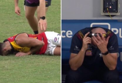Crows coach's shattered reaction to nasty knee injury