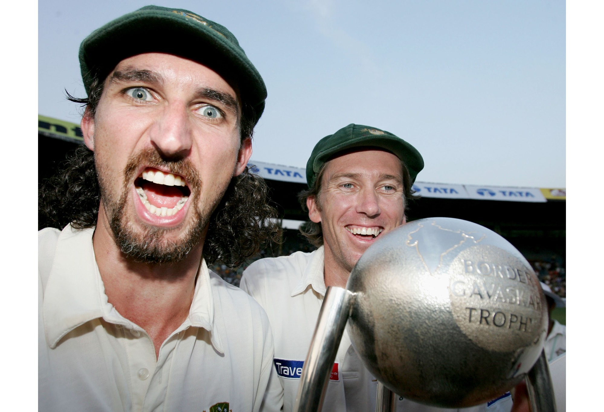 Jason Gillespie and Glenn McGrath of Australia celebrate with the Border Gavaskar Trophy after winning the series 2 - 1 with team mate Ricky Ponting looking on after day three of the Fourth Test between India and Australia at Wankhede Stadium on November 5, 2004 in Mumbai, India. (Photo by Hamish Blair/Getty Images)