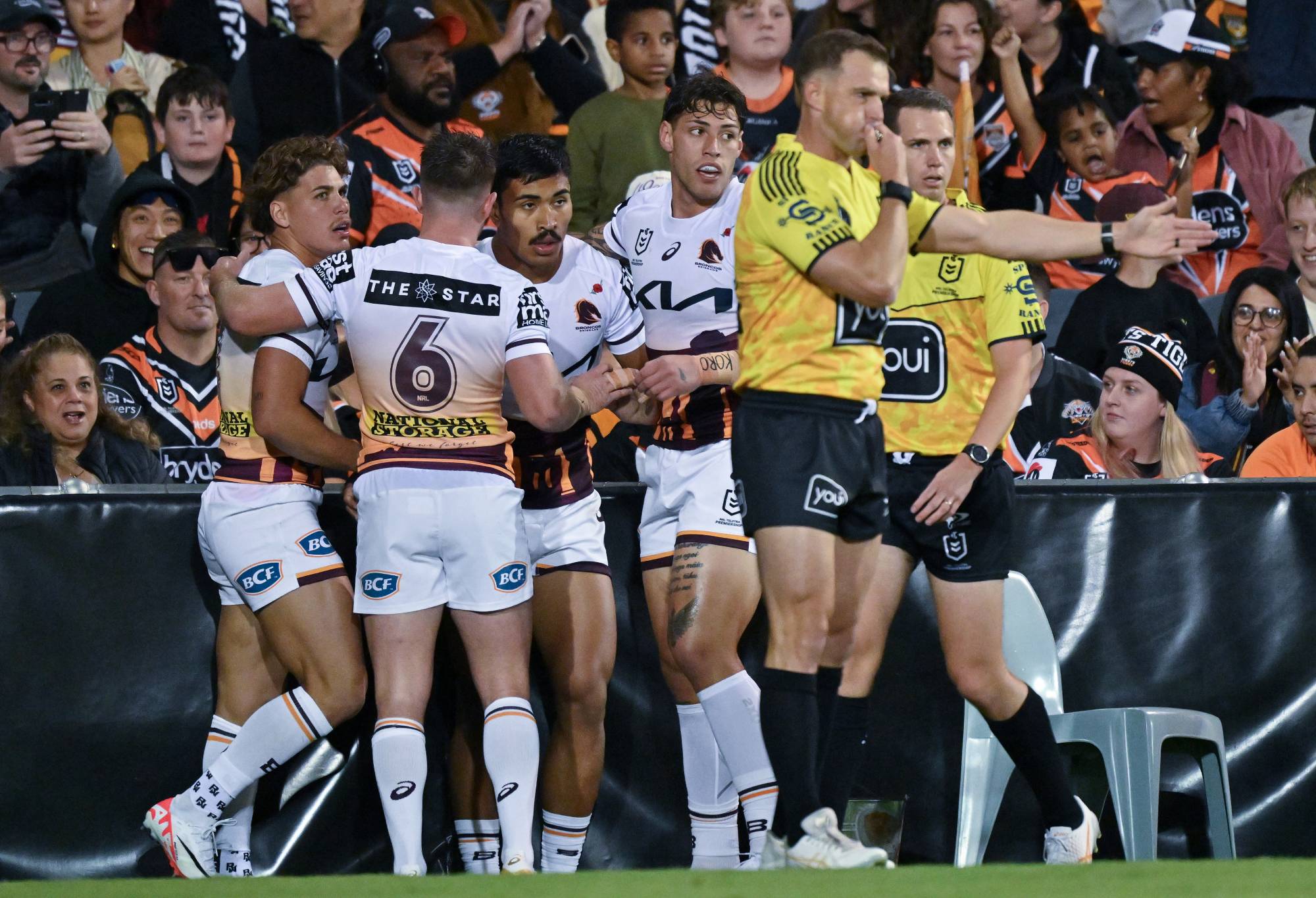 SYDNEY, AUSTRALIA - APRIL 27: Broncos players celebrates scoring a try during the round eight NRL match between Wests Tigers and Brisbane Broncos at Campbelltown Stadium, on April 27, 2024, in Sydney, Australia.