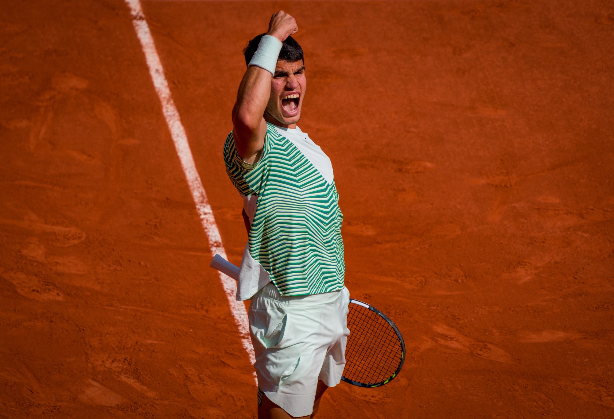 Carlos Alcaraz of Spain celebrates winning a point during the Men's Singles Semi Final Match against Novak Djokovic of Serbia during Day 13 of the French Open at Roland Garros on June 9, 2023 in Paris, France. (Photo by Andy Cheung/Getty Images)