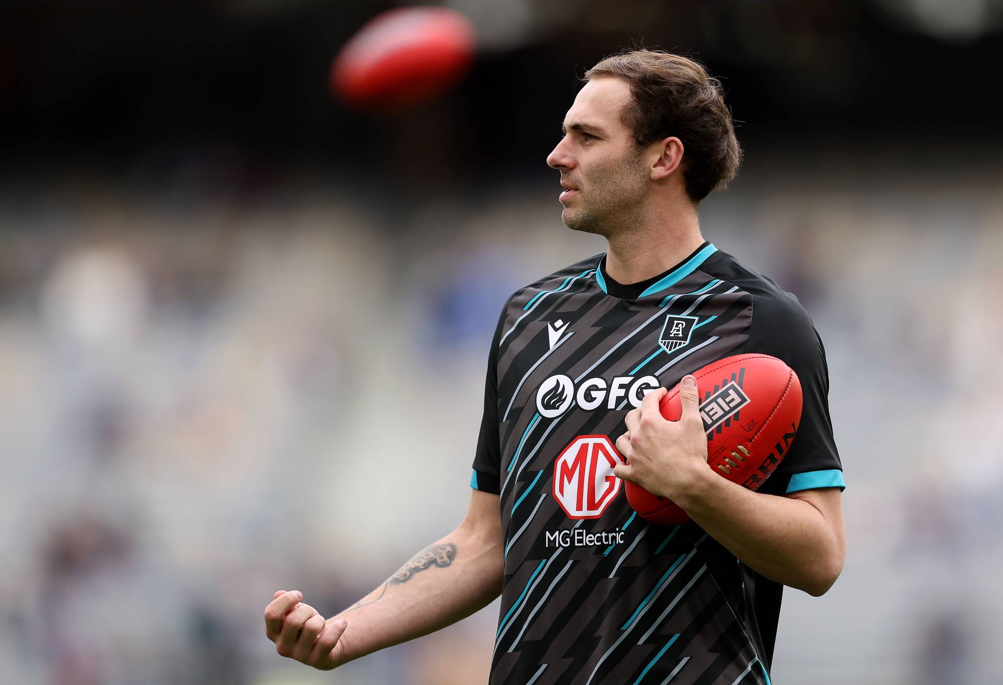 Jeremy Finlayson of the Power warms up before the round 23 AFL match between Fremantle Dockers and Port Adelaide Power at Optus Stadium, on August 20, 2023, in Perth, Australia. (Photo by Paul Kane/Getty Images)