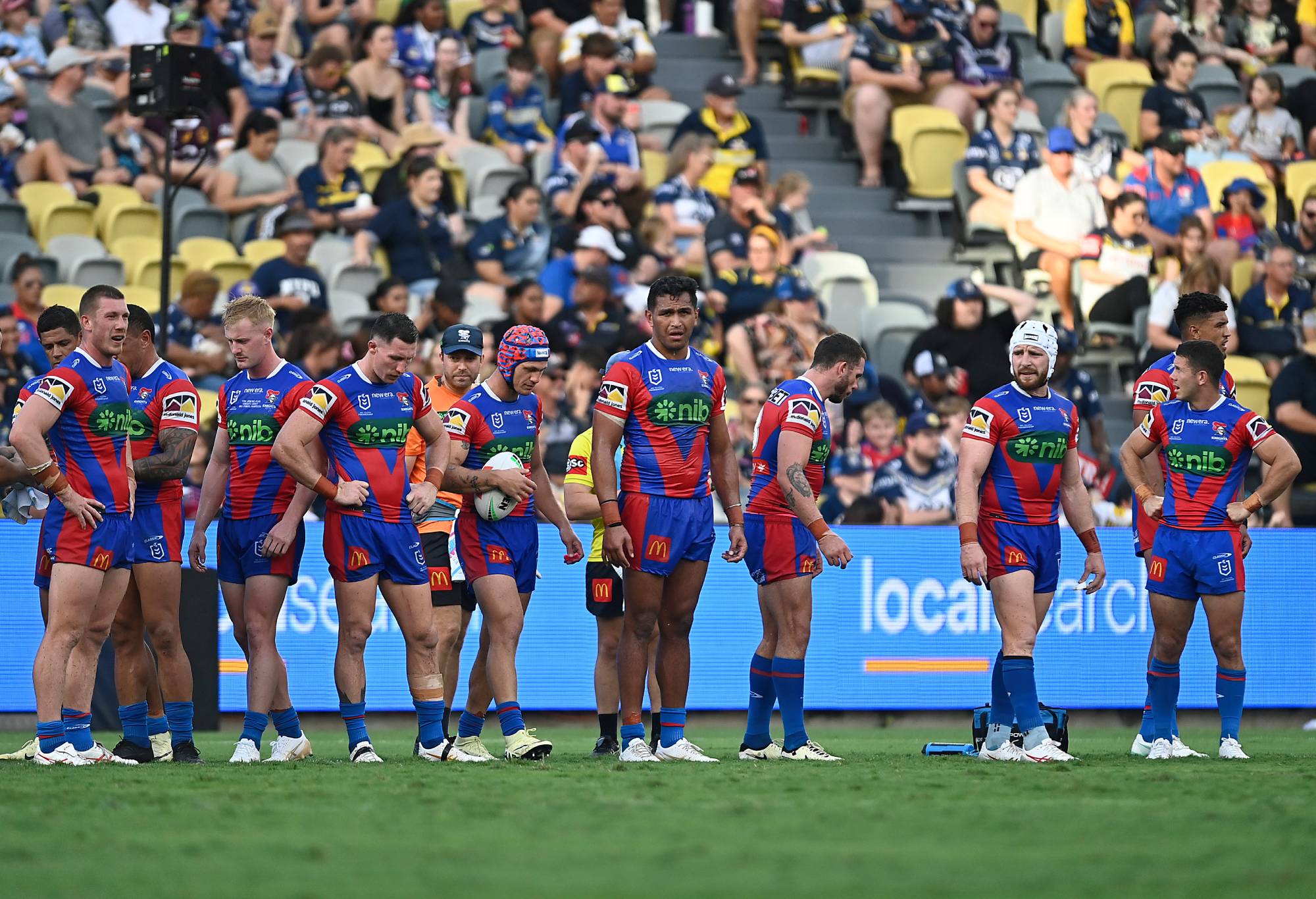 TOWNSVILLE, AUSTRALIA - MARCH 16: The Knights look on after a Cowboys try during the round two NRL match between North Queensland Cowboys and Newcastle Knights at Qld Country Bank Stadium, on March 16, 2024, in Townsville, Australia. (Photo by Ian Hitchcock/Getty Images)