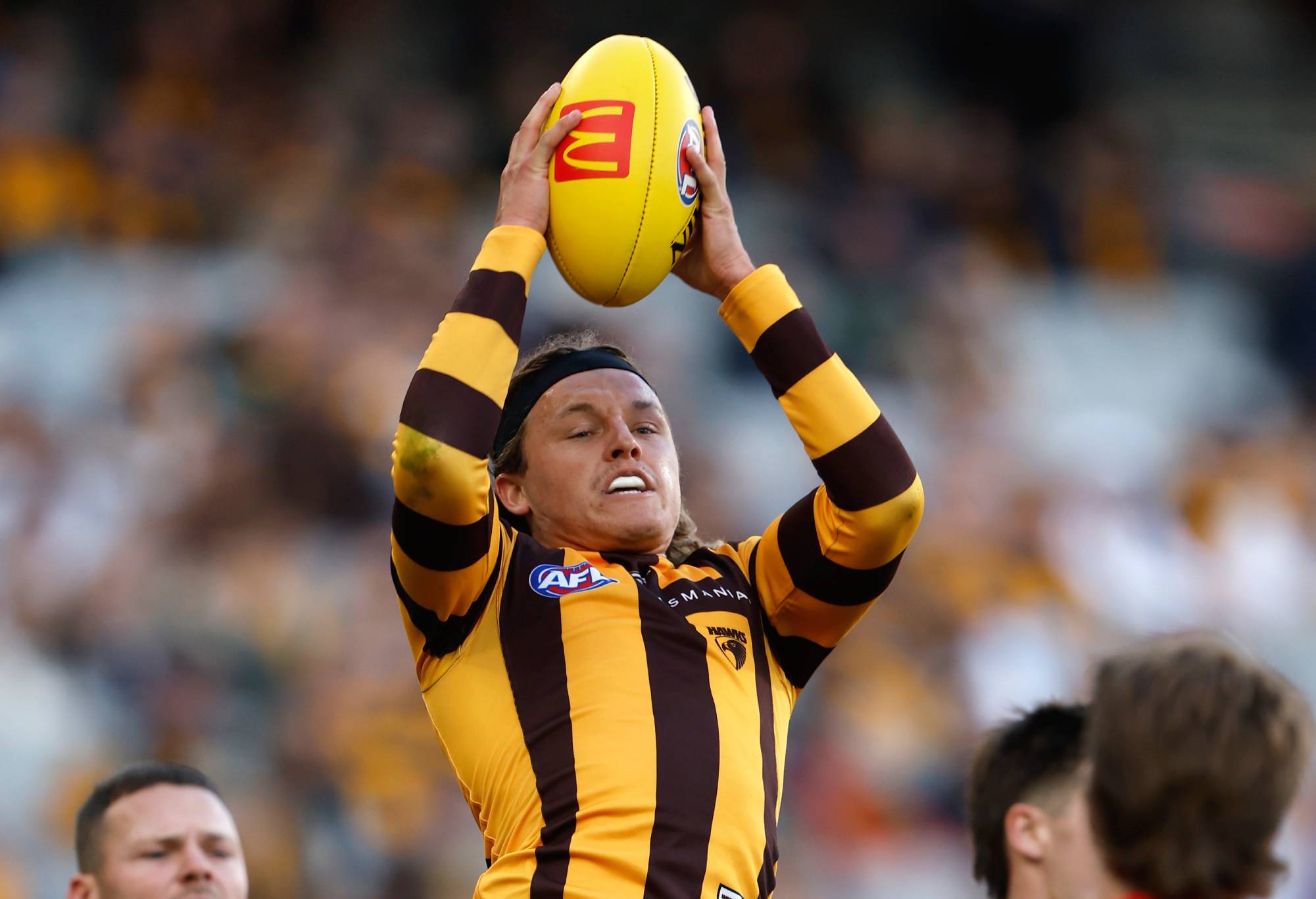 MELBOURNE, AUSTRALIA - MARCH 23: Jack Ginnivan of the Hawks marks the ball during the round two AFL match between Hawthorn Hawks and Melbourne Demons at Melbourne Cricket Ground, on March 23, 2024, in Melbourne, Australia. (Photo by Darrian Traynor/Getty Images)