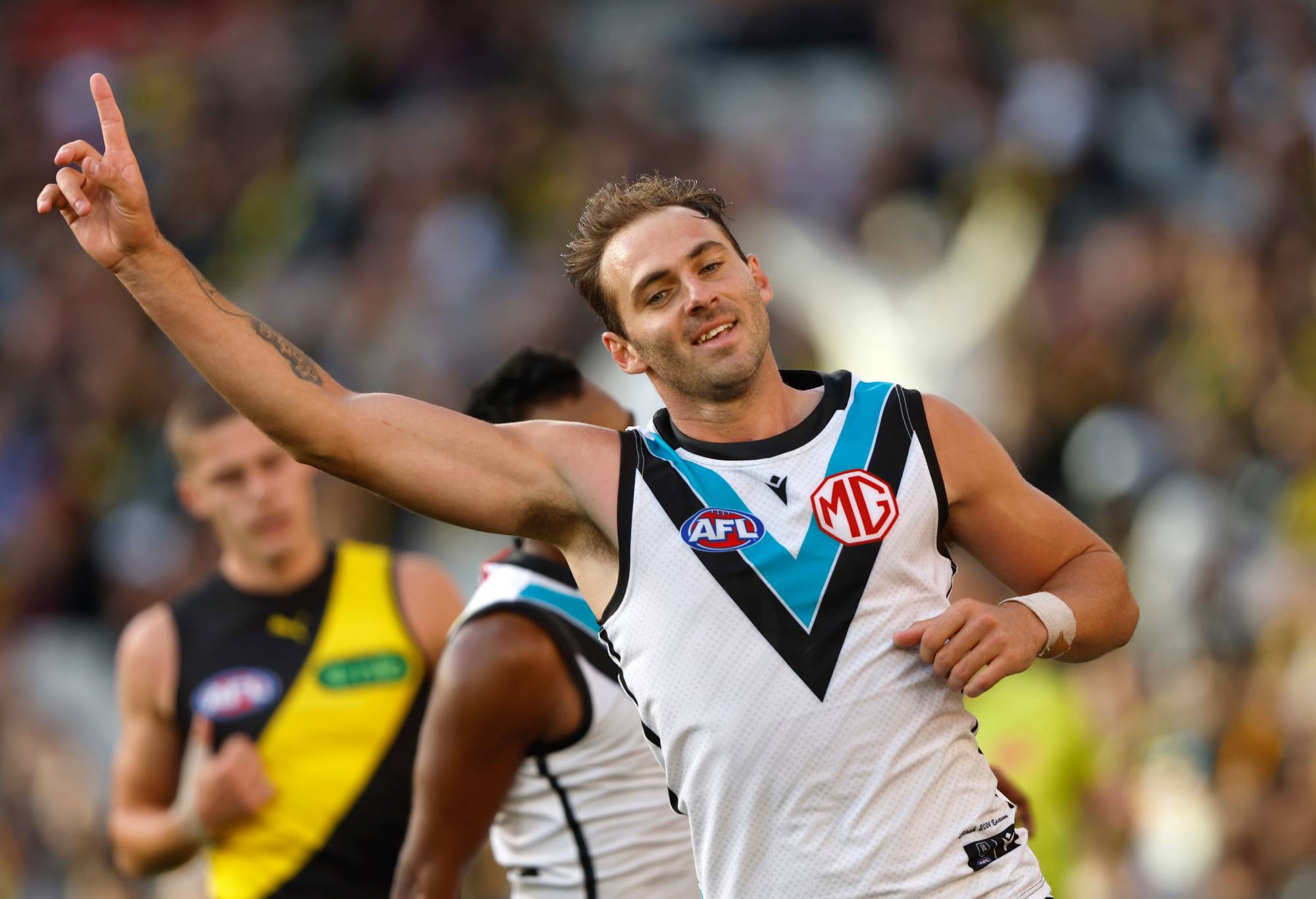 MELBOURNE, AUSTRALIA - MARCH 24: Jeremy Finlayson of the Power celebrates a goal during the round two AFL match between Richmond Tigers and Port Adelaide Power at Melbourne Cricket Ground, on March 24, 2024, in Melbourne, Australia. (Photo by Darrian Traynor/Getty Images)