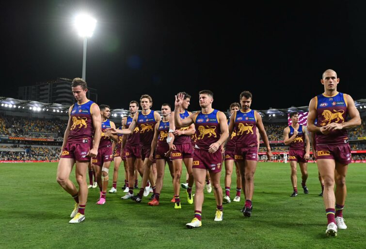 BRISBANE, AUSTRALIA - MARCH 28: Brisbane Lions leave the field after their defeat during the round three AFL match between Brisbane Lions and Collingwood Magpies at The Gabba, on March 28, 2024, in Brisbane, Australia. (Photo by Albert Perez/AFL Photos via Getty Images )