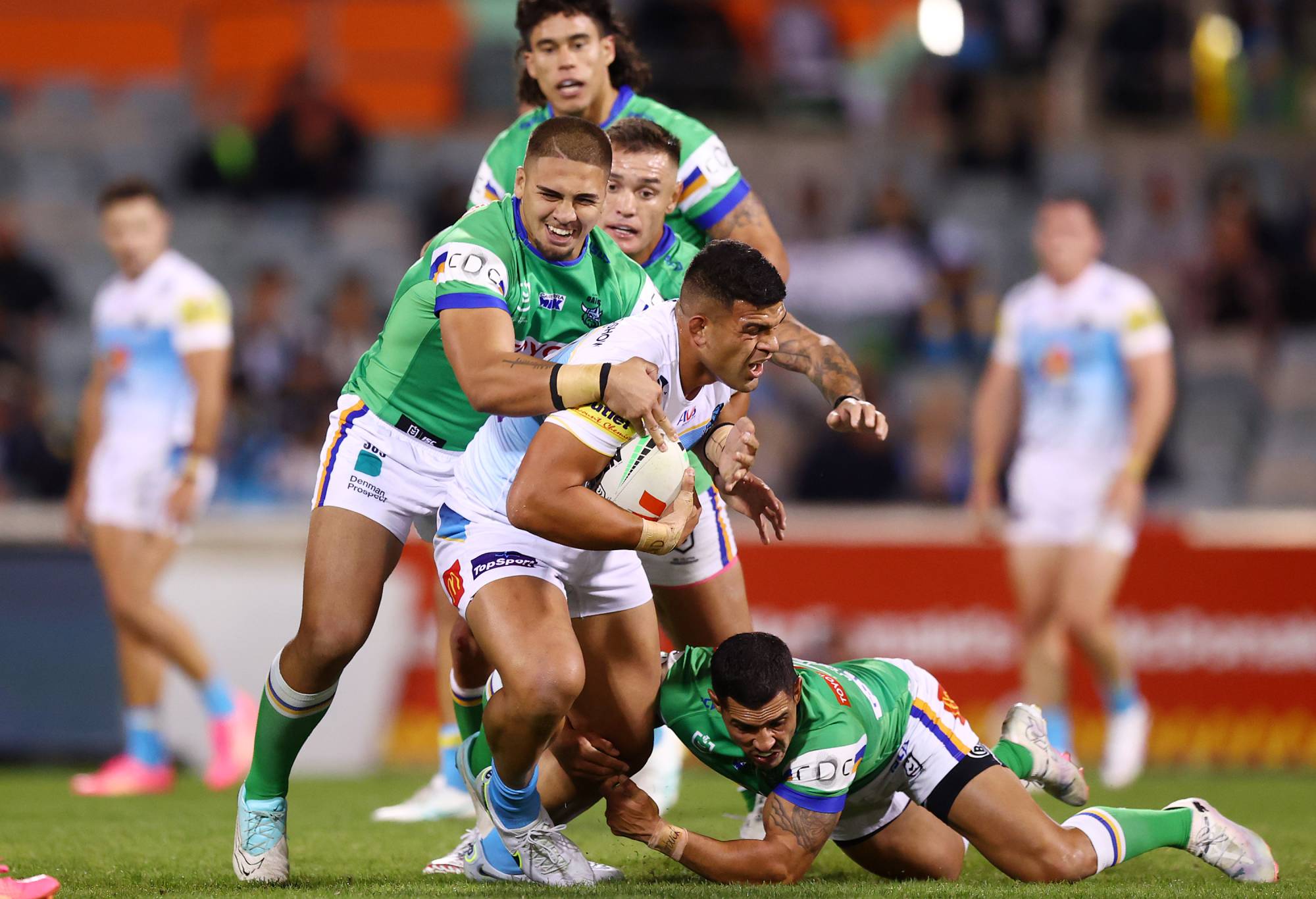CANBERRA, AUSTRALIA - APRIL 14: David Fifita of the Titans is tackled during the round six NRL match between Canberra Raiders and Gold Coast Titans at GIO Stadium, on April 14, 2024, in Canberra, Australia. (Photo by Mark Nolan/Getty Images)