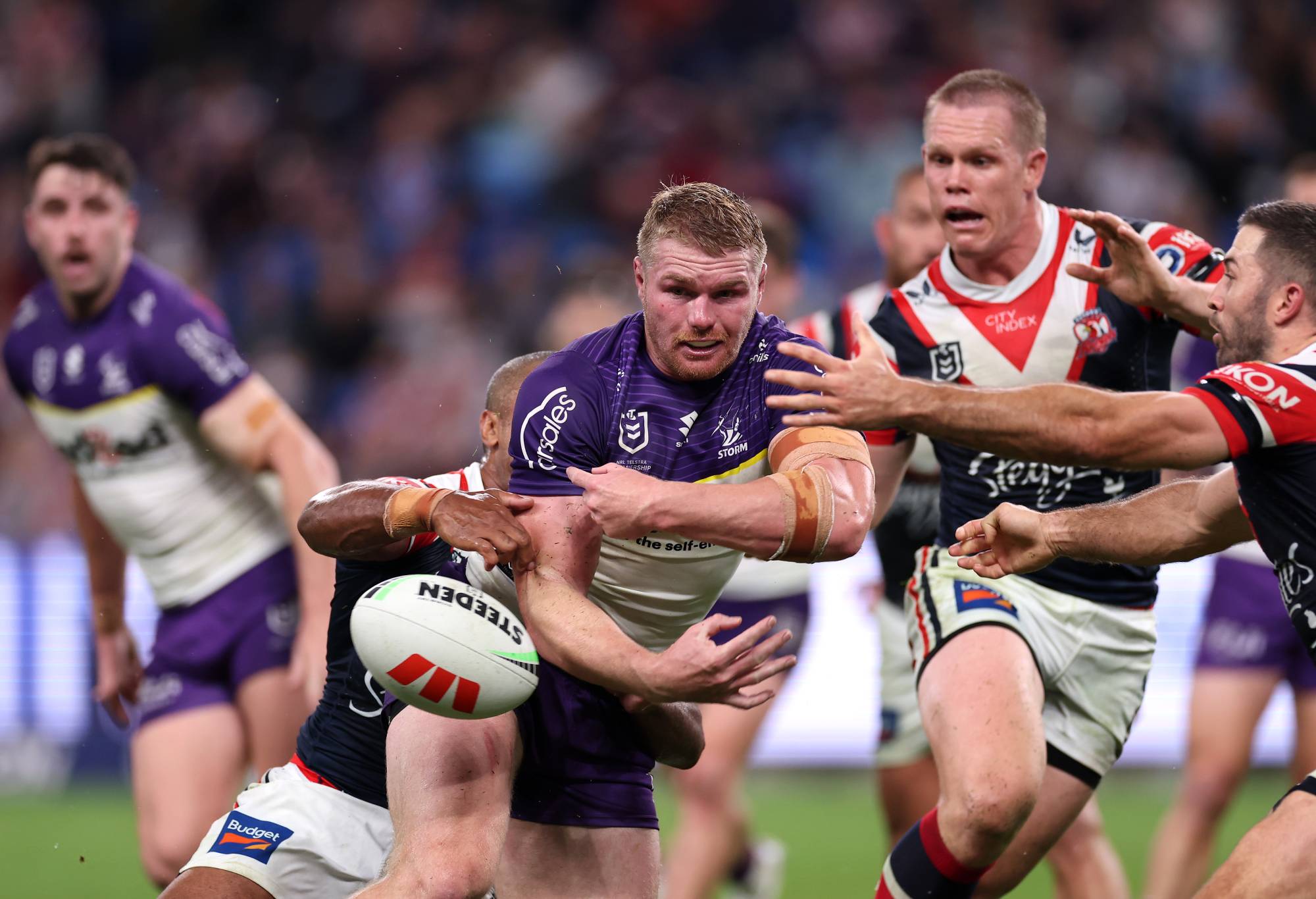 SYDNEY, AUSTRALIA - APRIL 18: Josh King of the Storm is tackled during the round seven NRL match between Sydney Roosters and Melbourne Storm at Allianz Stadium on April 18, 2024, in Sydney, Australia. (Photo by Cameron Spencer/Getty Images)