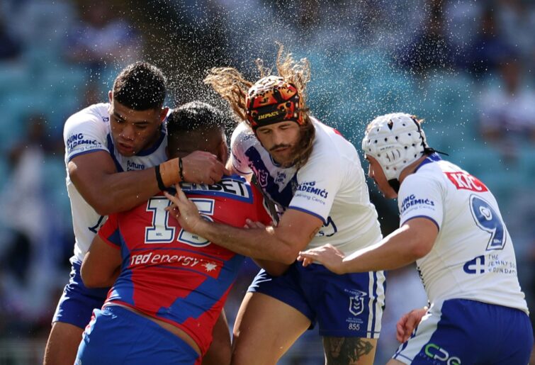 SYDNEY, AUSTRALIA - APRIL 21: Daniel Saifiti of the Knights is tackled during the round seven NRL match between Canterbury Bulldogs and Newcastle Knights at Accor Stadium, on April 21, 2024, in Sydney, Australia. (Photo by Mark Kolbe/Getty Images)