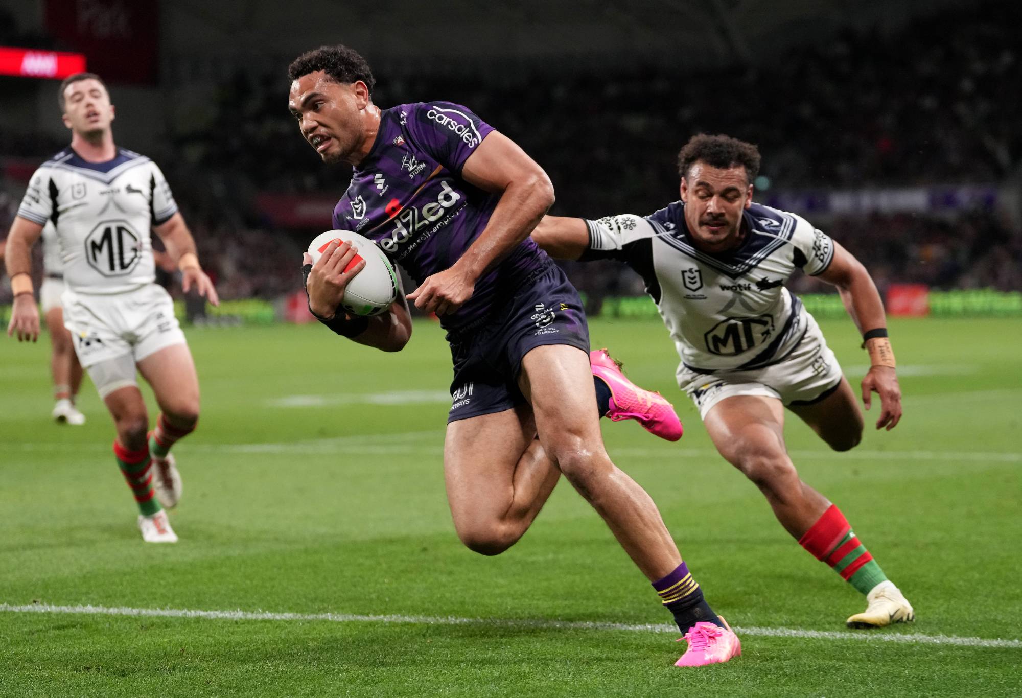 MELBOURNE, AUSTRALIA - APRIL 25: Xavier Coates of the Storm breaks a tackle to score a try during the round eight NRL match between Melbourne Storm and South Sydney Rabbitohs at AAMI Park on April 25, 2024, in Melbourne, Australia. (Photo by Daniel Pockett/Getty Images)