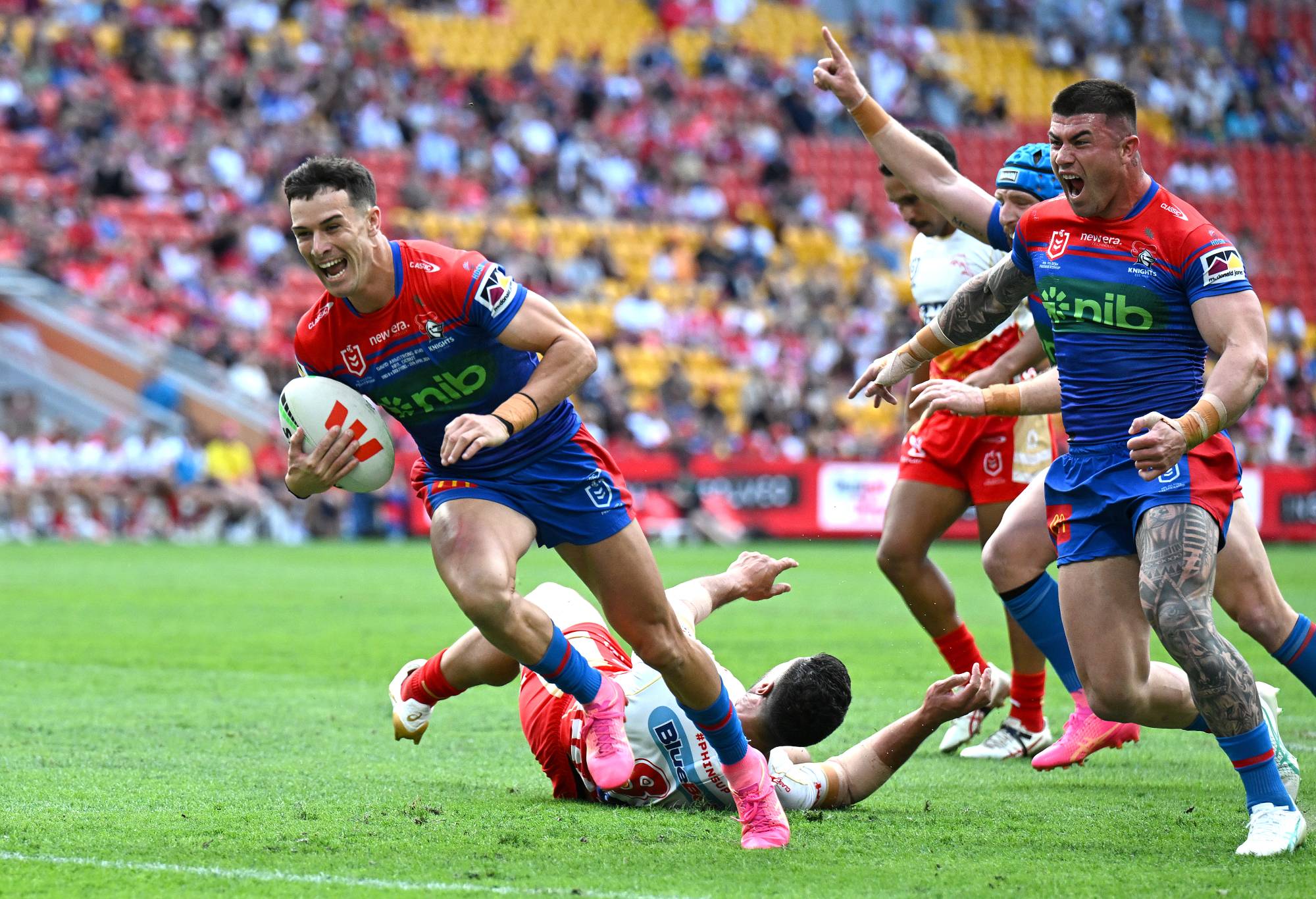 BRISBANE, AUSTRALIA - APRIL 28: David Armstrong of the Knights scores a try during the round eight NRL match between Dolphins and Newcastle Knights at Suncorp Stadium, on April 28, 2024, in Brisbane, Australia. (Photo by Bradley Kanaris/Getty Images)