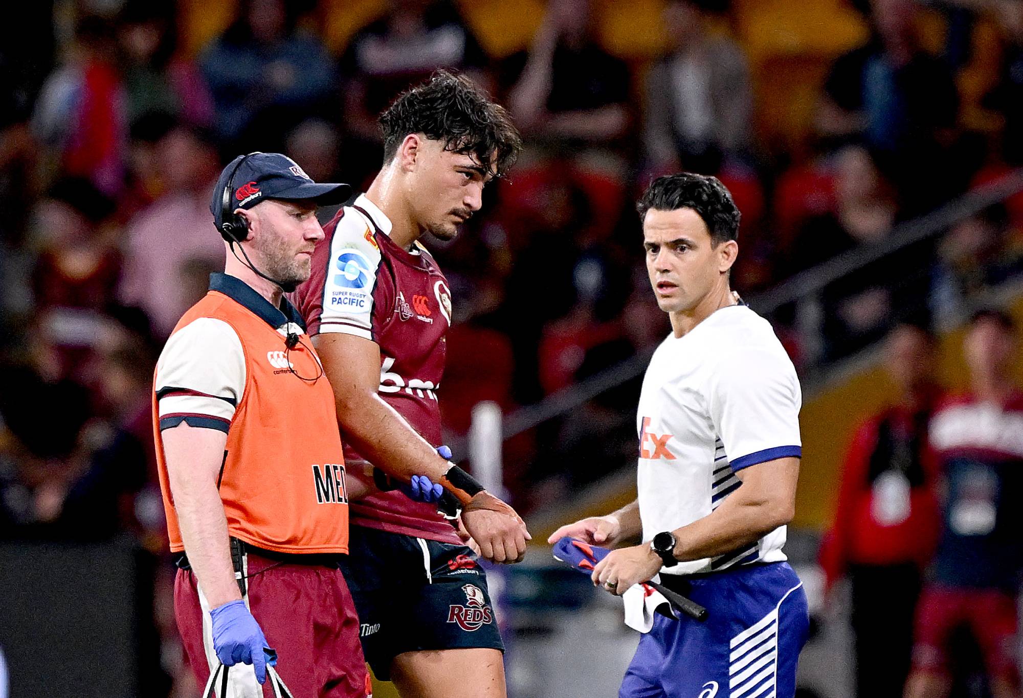 Jordan Petaia of the Reds is taken from the field injured during the round nine Super Rugby Pacific match between Queensland Reds and Highlanders at Suncorp Stadium, on April 19, 2024, in Brisbane, Australia. (Photo by Bradley Kanaris/Getty Images)