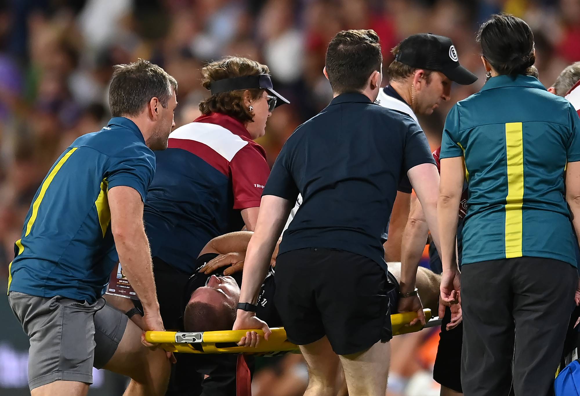Lachlan Lonergan of the Brumbies is stretchered off the field after suffering an injury during the round six Super Rugby Pacific match between Queensland Reds and ACT Brumbies at Suncorp Stadium, on March 30, 2024, in Brisbane, Australia. (Photo by Albert Perez/Getty Images)