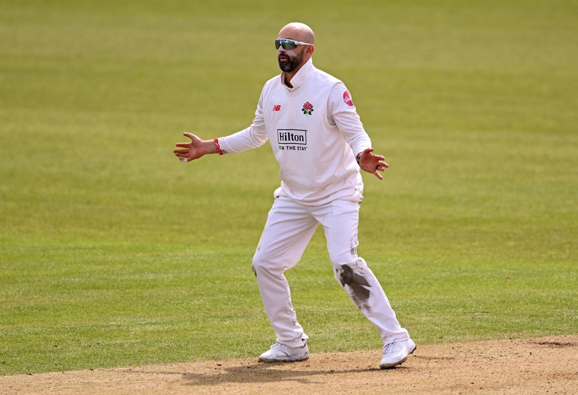 SOUTHAMPTON, ENGLAND - APRIL 12: Nathan Lyon of Lancashire in action during the Vitality County Championship Division One match between Hampshire and Lancashire at Utilita Bowl on April 12, 2024 in Southampton, England.
