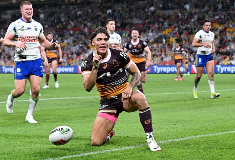 BRISBANE, AUSTRALIA - APRIL 20: Reece Walsh of the Broncos celebrates after scoring a try during the round seven NRL match between the Brisbane Broncos and Canberra Raiders at Suncorp Stadium, on April 20, 2024, in Brisbane, Australia.