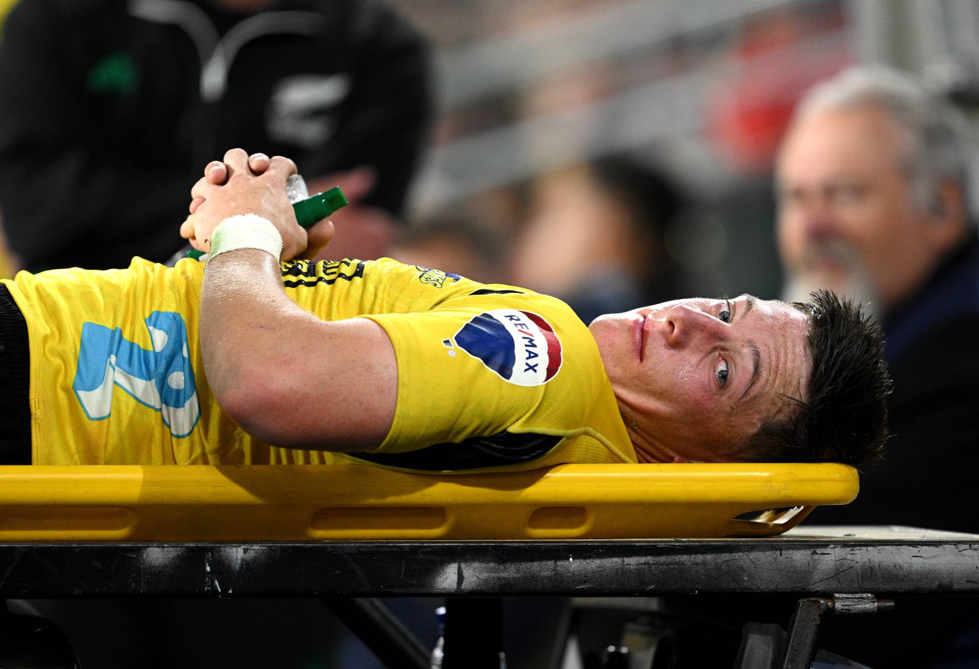 Cam Roigard of the Hurricanes leaves the field of play after sustaining an injury during the round six Super Rugby Pacific match between Highlanders and Hurricanes at Forsyth Barr Stadium, on March 30, 2024, in Dunedin, New Zealand. (Photo by Joe Allison/Getty Images)