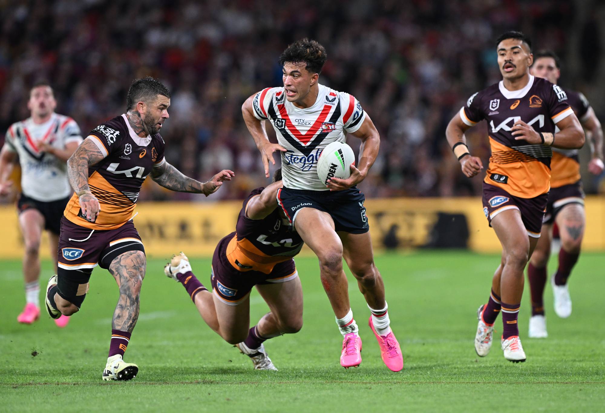 BRISBANE, AUSTRALIA - MAY 03: Joseph-Aukuso Suaalii of the Roosters makes a break during the round nine NRL match between Brisbane Broncos and Sydney Roosters at Suncorp Stadium on May 03, 2024, in Brisbane, Australia. (Photo by Bradley Kanaris/Getty Images)