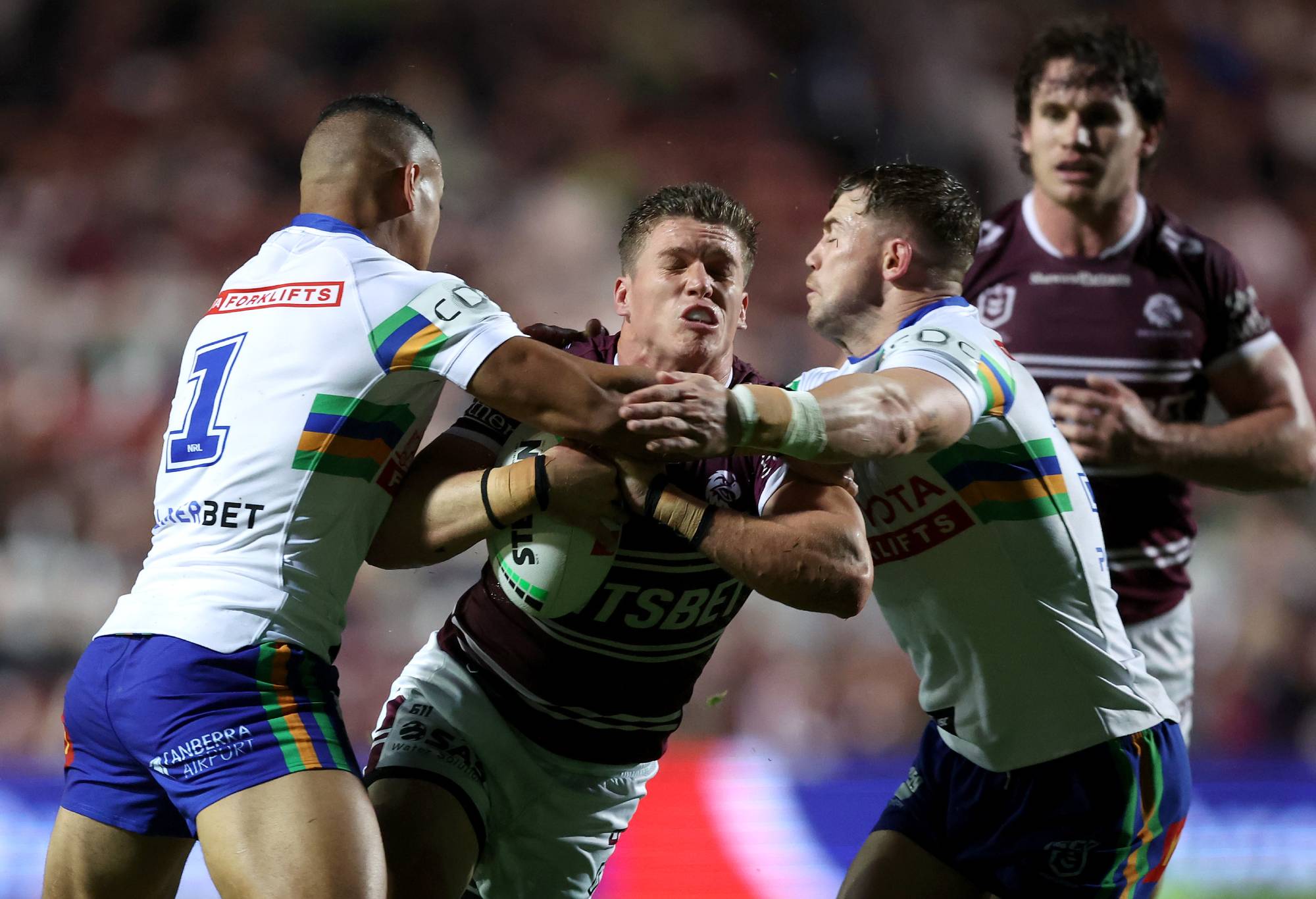 SYDNEY, AUSTRALIA - MAY 03: Reuben Garrick of the Sea Eagles is tackled during the round nine NRL match between Manly Sea Eagles and Canberra Raiders at 4 Pines Park on May 03, 2024, in Sydney, Australia.