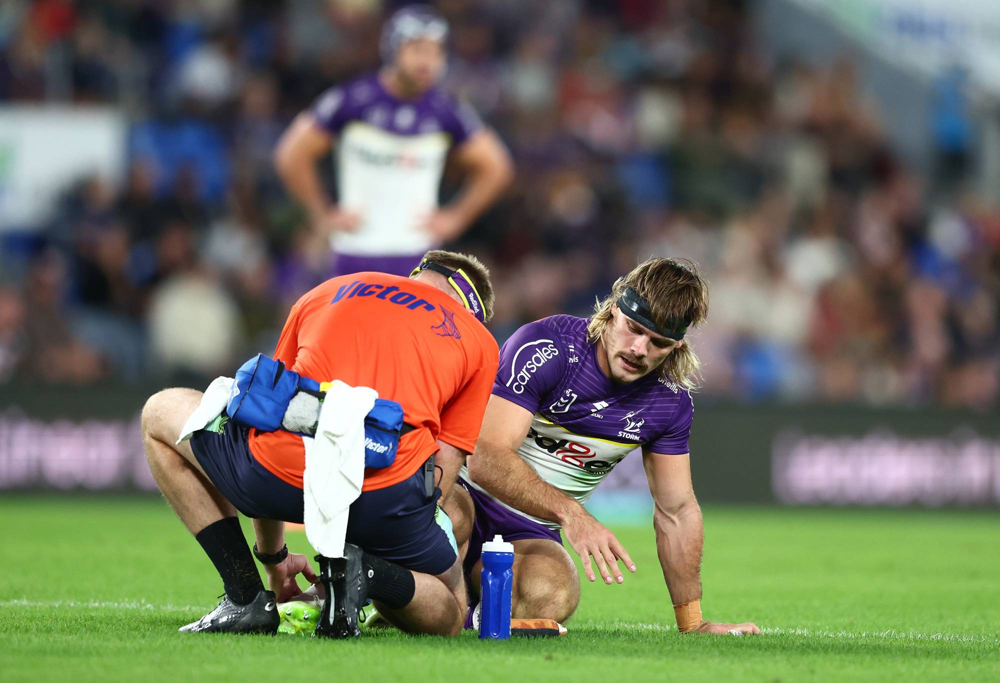 GOLD COAST, AUSTRALIA - MAY 04: Ryan Papenhuyzen of the Storm is injured during the round nine NRL match between Gold Coast Titans and Melbourne Storm at Cbus Super Stadium, on May 04, 2024, in Gold Coast, Australia.
